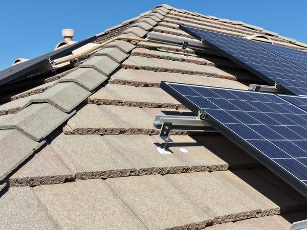 Close-up of lag bolt mounts without proper flashing