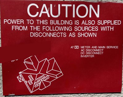 Fire safety placard showing original 23-panel roof layout with disconnect locations — required by electrical code for first responder awareness